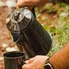 Pouring a hot drink from the coffee boiler