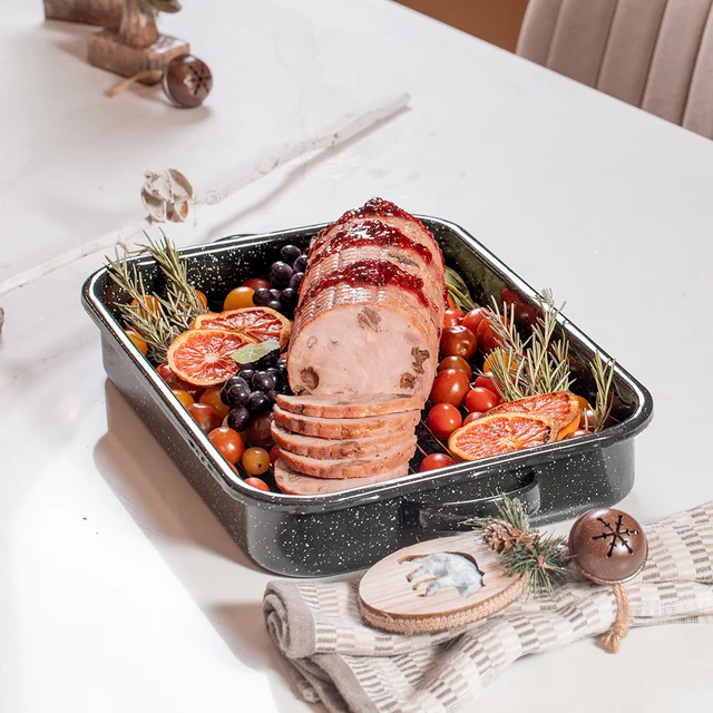 Sliced roast and vegetables in a rectangular pan